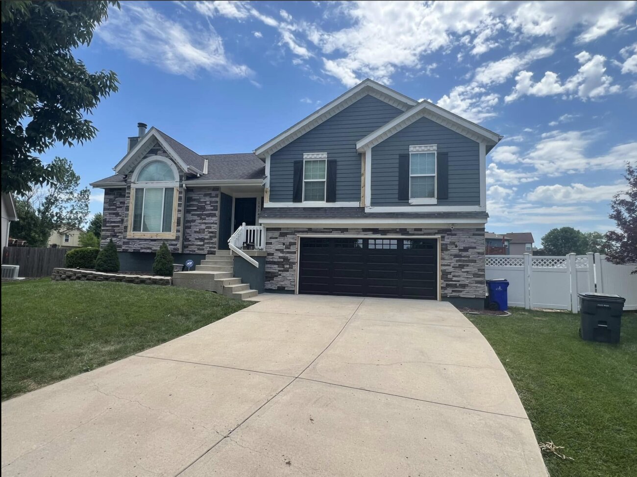 Stone-front home exterior makeover by KFR Construction