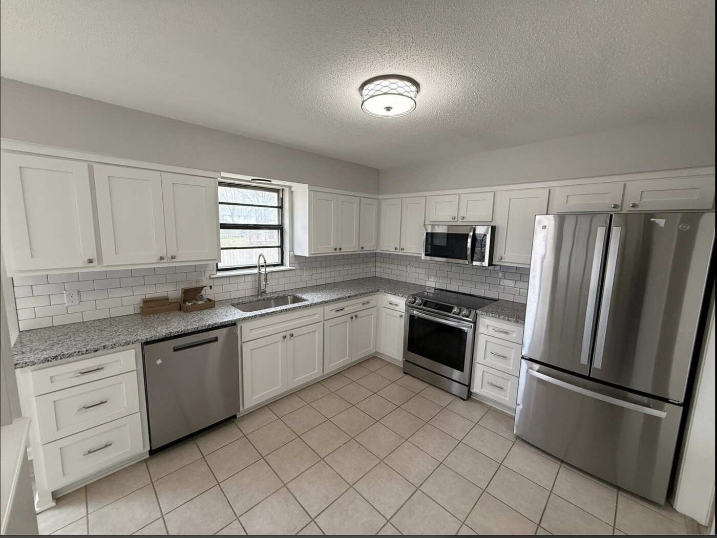 Kitchen remodel with granite and subway tile