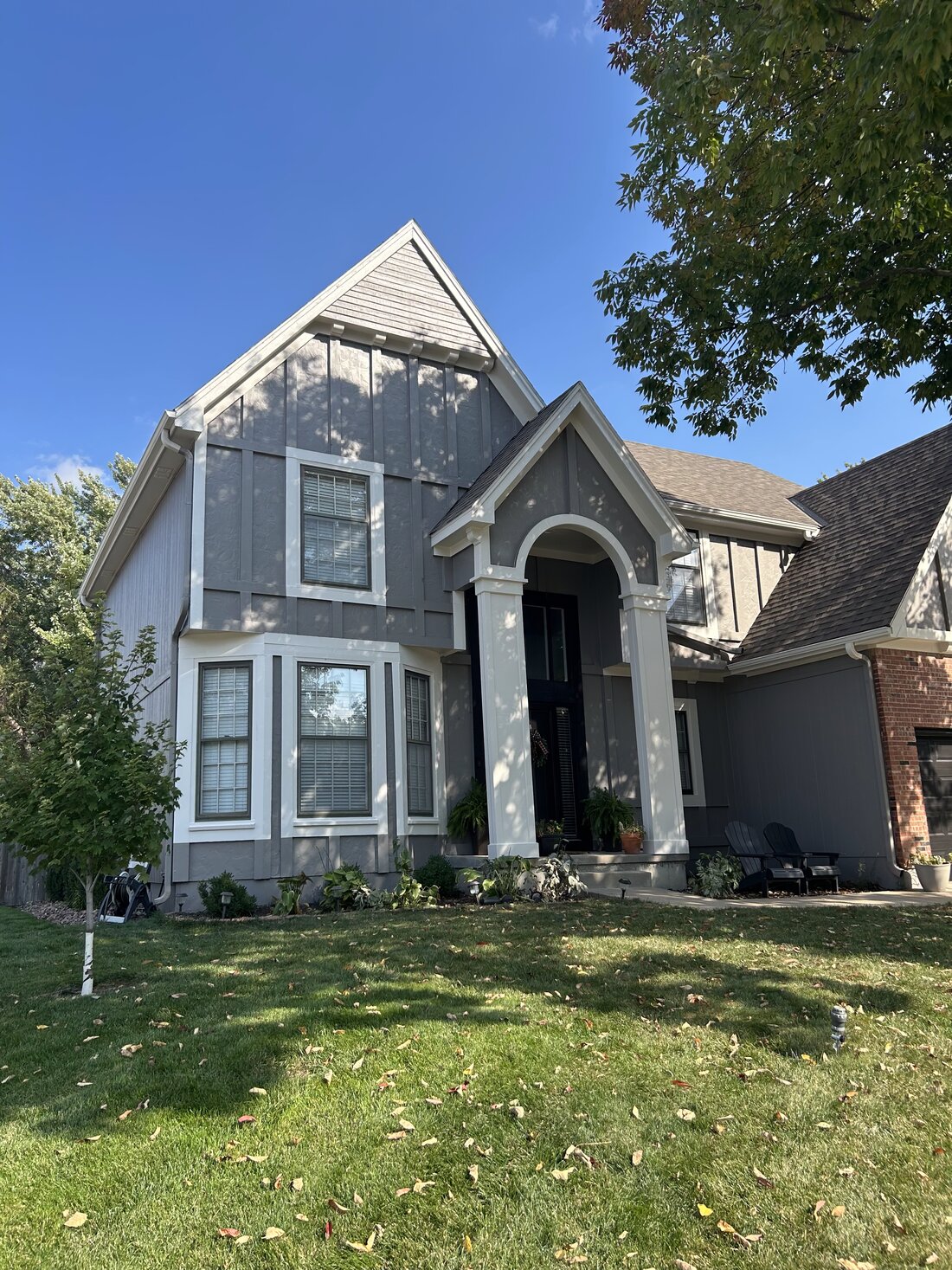 Modern gray board-and-batten Tudor exterior repaint by KFR Construction in Kansas City